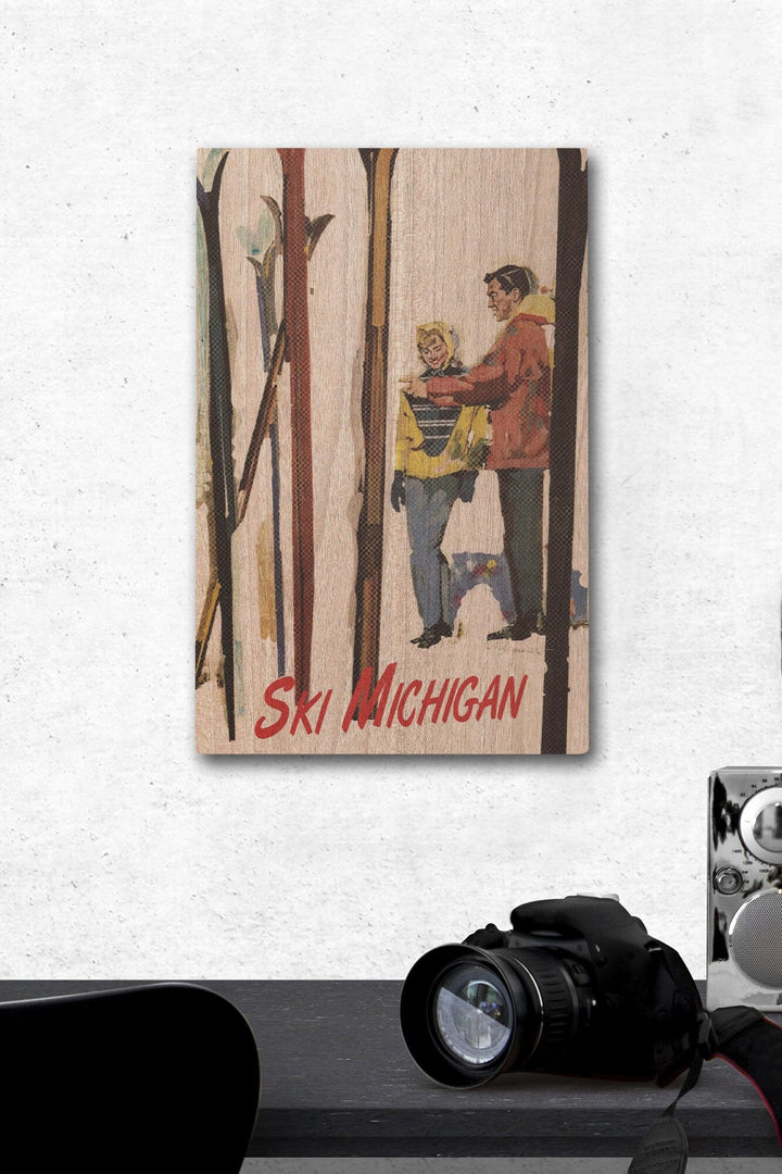 Ski Michigan, Couple by Skis in the Snow, Lantern Press Artwork, Wood Signs and Postcards Wood Lantern Press 12 x 18 Wood Gallery Print 
